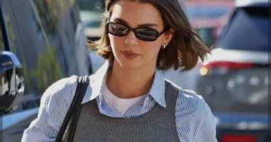 Kendall Jenner-inspired street style with oversized blazer and bike shorts in a trendy city setting.