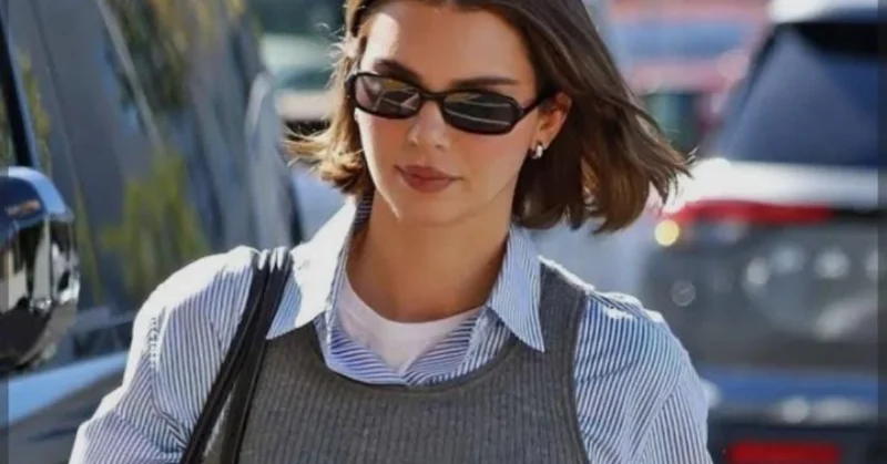 Kendall Jenner-inspired street style with oversized blazer and bike shorts in a trendy city setting.