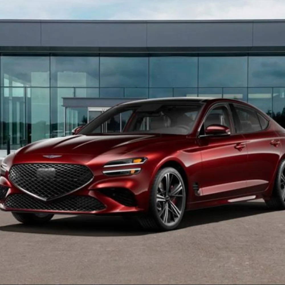 Luxurious interior of the Genesis G70 2.5T Sport Prestige with premium materials, advanced tech display, and sporty design accents. 