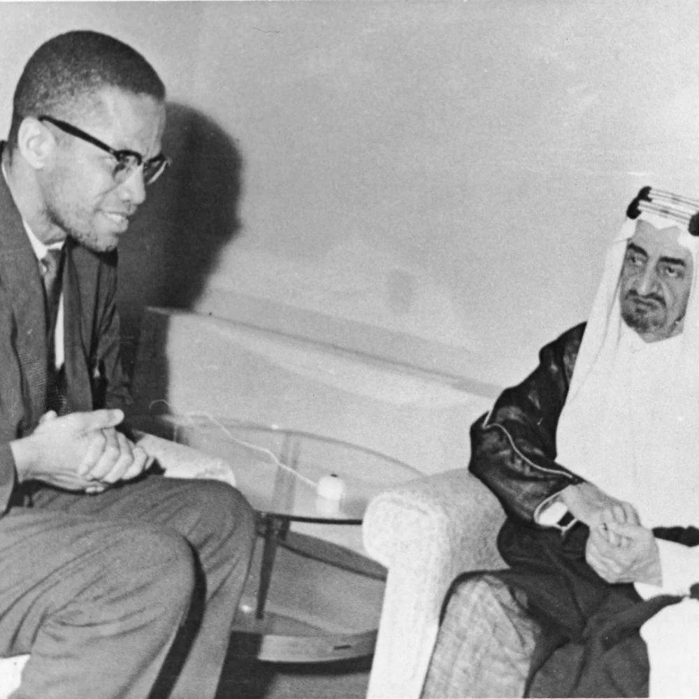 an image of Malcolm X meeting with Prince Faisal bin Abdulaziz. (1964)