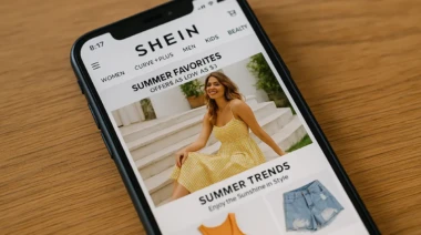 A smartphone displaying the Shein shopping app with trendy fashion items.